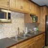 Oak cabinets; laminate with walnut edge top and molding
